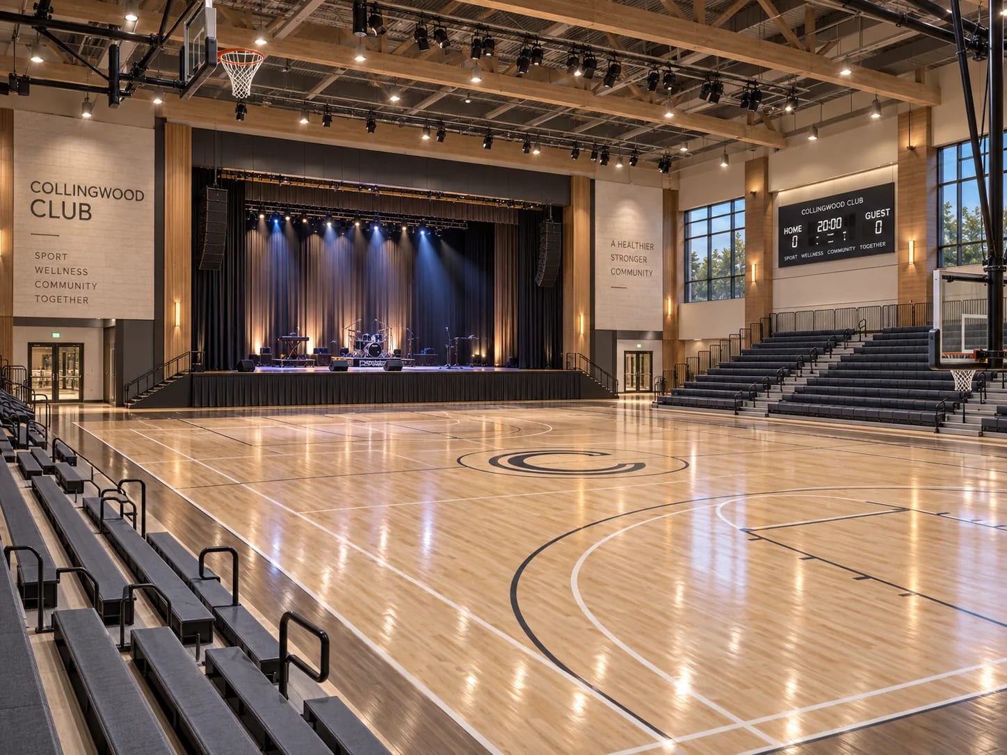 The same gymnasium with a theatrical stage at one end, so the floor can hold a performance, a ceremony or an exam sitting.